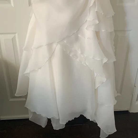 Beautiful off white Demtria cascading wedding dress.  Size 10, but altered. - Picture 6 of 12